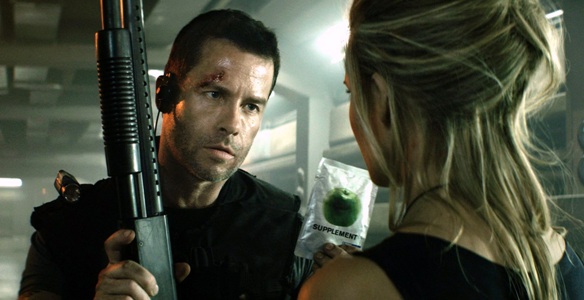 Guy-Pearce-as-Snow-and-Maggie-Grace-as-Emilie-Warnock-Lockout-movie